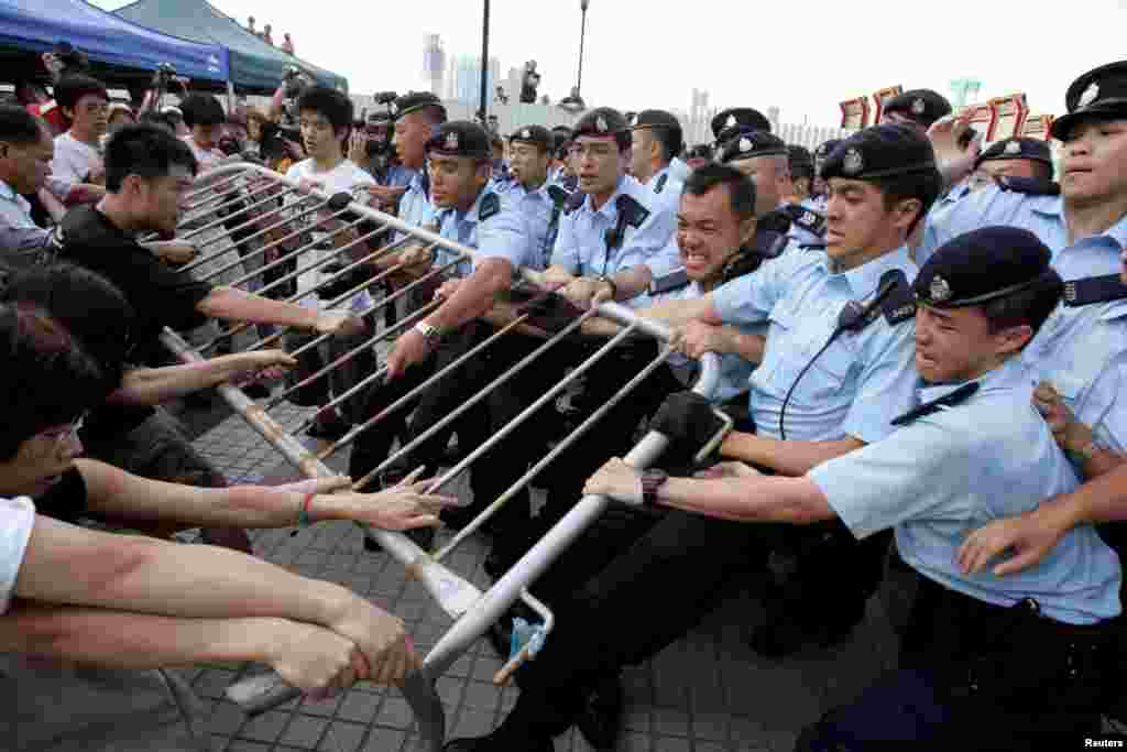 Activists fight to save the Queen's Pier in Hong Kong's financial district, Aug. 1, 2007. The colonial-era pier became a civic battleground in 2007. The government wanted it removed for reclamation and roadworks, angering activists fighting to save a historic site.