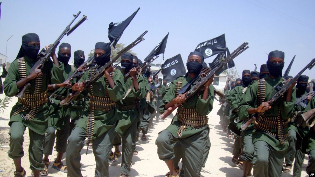 FILE - Al-Shabab fighters are seen marching with their weapons during exercises on the outskirts of Mogadishu, Somalia, Feb. 17, 2011. The Pentagon says President Donald Trump has given it more authority to attack al-Shabab targets