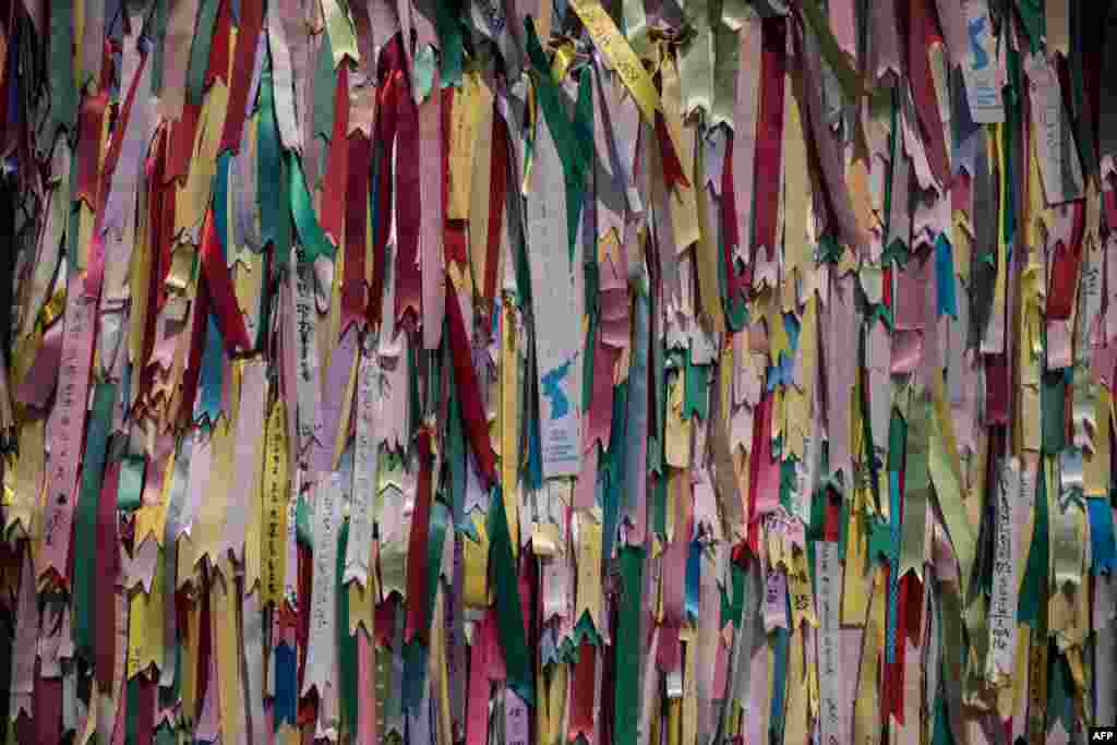 Ribbons featuring messages are displayed on a fence at the Imjingak Peace Park near the Demilitarized Zone (DMZ) separating North and South Korea in Paju. Washington's top diplomat, Secretary of State Rex Tillerson, visited the Demilitarized Zone dividing the two Koreas to gaze on the North for himself, a day after he declared 20 years of efforts to denuclearize it had failed.