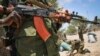 A fighter stands guard in southern Somali port city of Kismayo, June 2013 file photo.