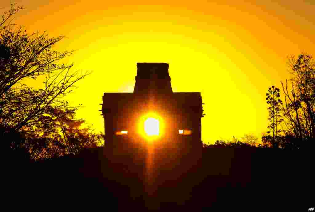 The sun shines directly through the door of the Seven Dolls Temple, in the Maya Ruins of Dzibilchaltun, in the Mexican state of Yucatan, as it rises on the spring equinox, March 20, 2017.