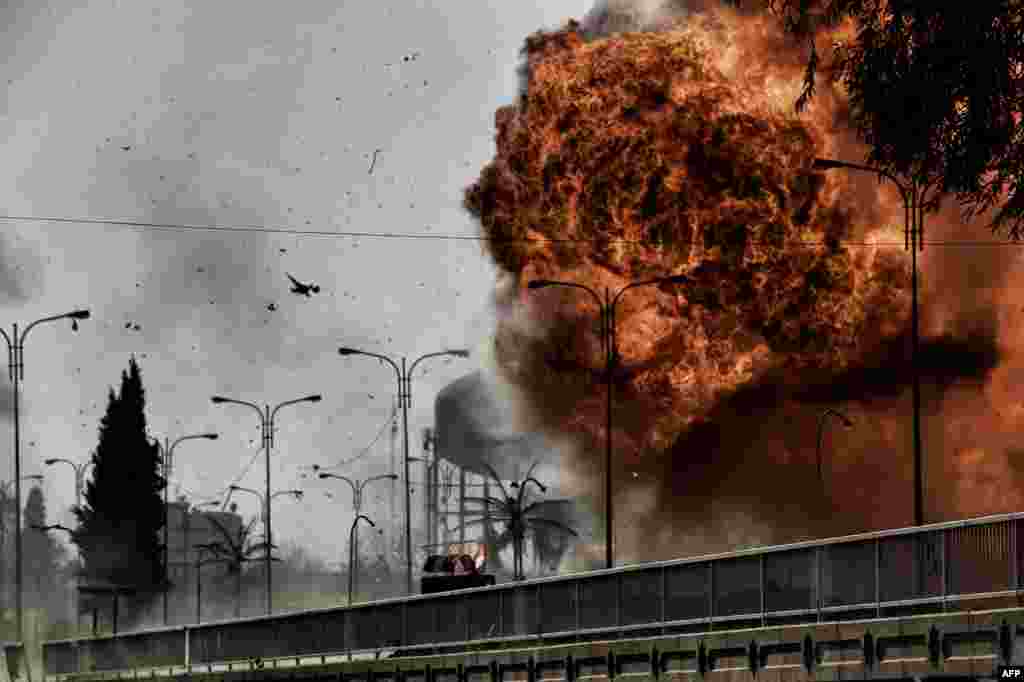 Fire and smoke billow following a car bomb explosion as Iraqi forces clash with Islamic State (IS) group fighters in Mosul, during an offensive to retake the western parts of the city from the jihadists.