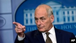 FILE - In this Oct. 12, 2017, file photo, White House Chief of Staff John Kelly calls on a reporter during the daily briefing at the White House in Washington. 