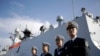 FILE - Chinese Navy officials stand in front of the ship Daqing.