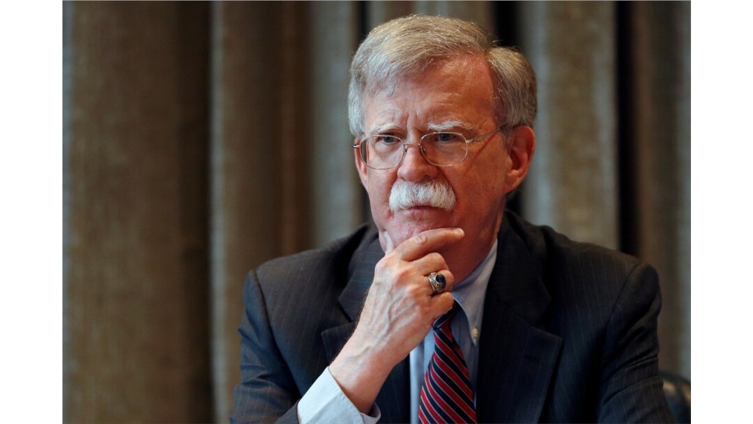 FILE - White House national security adviser John Bolton meets with journalists in London, Aug.12, 2019.