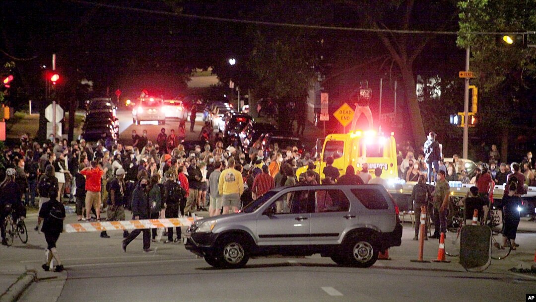 Protesters block traffic at an intersection an intersection near Capitol Square in Madison, Wis., June 23, 2020. 
