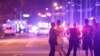 Police officers direct family members away from a fatal shooting at Pulse Orlando nightclub in Orlando, Fla., June 12, 2016. 