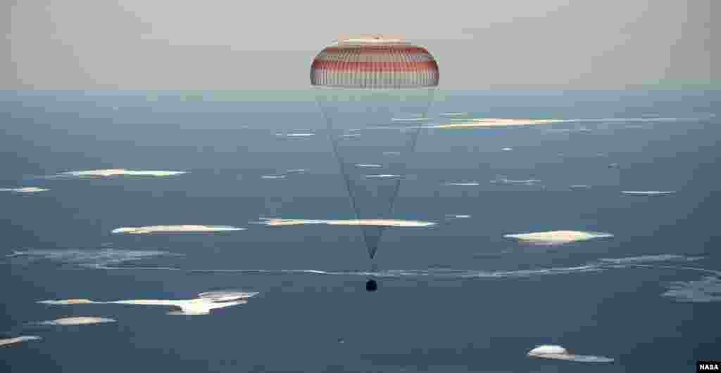 The Soyuz MS-02 spacecraft lands with Expedition 50 Commander Shane Kimbrough of NASA and Flight Engineers Sergey Ryzhikov and Andrey Borisenko of Roscosmos near the town of Zhezkazgan, Kazakhstan.