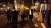 Protesters opposed to Egyptian President Mohammed Morsi evacuate and injured fellow protester during clashes between supporters of president Mohammed Morsi and their rivals in front of the president palace, in Cairo, Egypt, Wednesday, Dec. 5, 2012. 