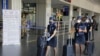 Airline crew members arrive at the airport as domestic flights resume operations after a nearly two-month lockdown amid the COVID-19 pandemic, in Ahmedabad, India, May 25, 2020.