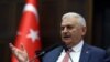 FILE - Turkish Prime Minster Binali Yildirim is seen addressing lawmakers at the parliament in Ankara, Turkey, May 24, 2016. 