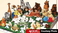 A product advertisement for the Korea Kyonghung Trading Corporation featured in a trade publication on a North Korean government website showing toys that look similar to Sesame Street Products.
