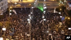 Egyptian army tanks secure the perimeter of the presidential palace while protesters gather chanting slogans against President Mohammed Morsi, in Cairo, Egypt, December 7, 2012.