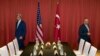 FILE - U.S. Secretary of State John Kerry, left, and Turkish Foreign Minister Mevlut Cavusoglu prepare to take part in a meeting ahead of the G20 summit in Hangzhou in eastern China's Zhejiang province, Sept. 3, 2016.