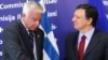 European Commission President Jose Manuel Barroso, right, welcomes Greek Prime Minister Panagiotis Pikrammenos at the European Commission headquarters in Brussels, May 23, 2012. 