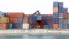 A crane arranges containers at the Port of Zanzibar on the island of Zanzibar, July 19, 2012. 