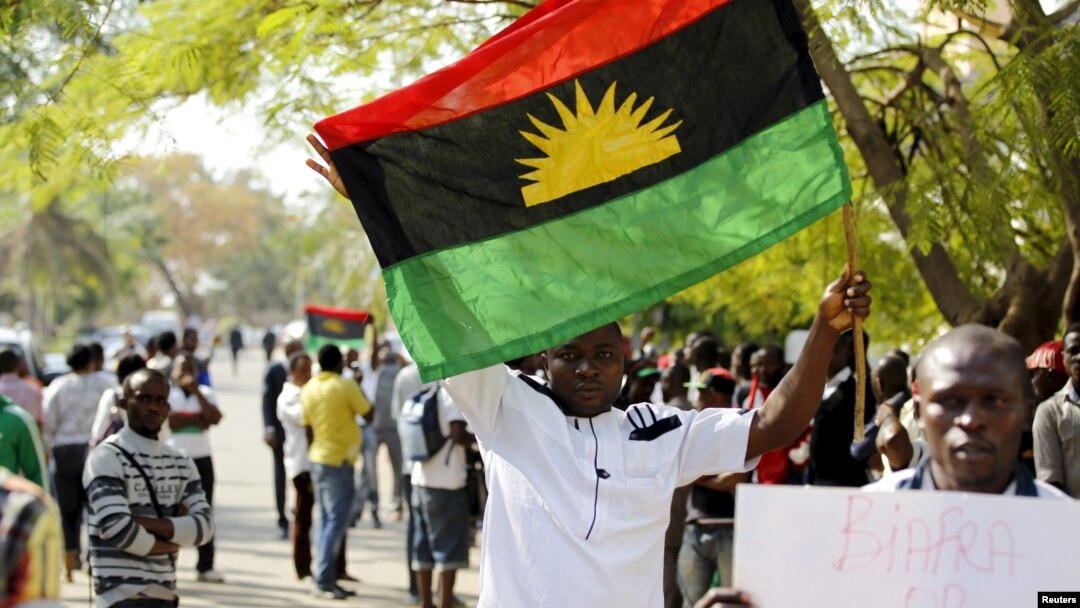 FILE - A supporter of Indigenous People of Biafra (IPOB) leader Nnamdi Kanu holds a Biafra flag during a rally in support of Kanu in Abuja, Nigeria, Dec. 1, 2015