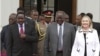 Kenya's President Mwai Kibaki (C), flanked by U.S. Secretary of State Hillary Clinton (R) and his vice president Kalonzo Musyoka (L), leaves after a meeting at State House in Nairobi August 4, 2012. 