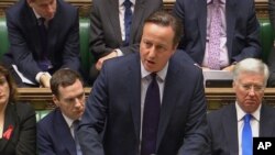 英国首相卡梅伦在议会辩论英国是否参加空袭在叙利亚的伊斯兰国行动时发言。（2015年12月2日）