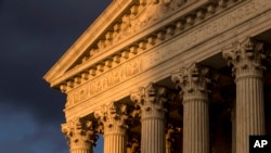 FILE - In this Oct. 10, 2017, file photo, the Supreme Court in Washington is seen at sunset. 