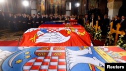 The coffins of Serbian King Petar II Karadjordjevic and his wife Queen Aleksandra, mother Queen Maria and brother Prince Andrej lie inside the St. George's Church on Oplenac Hill during their funeral in Topola, Serbia, May 26, 2013.