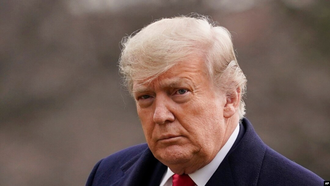 In this Dec. 31, 2020, file photo, President Donald Trump arrives on the South Lawn of the White House, in Washington. 