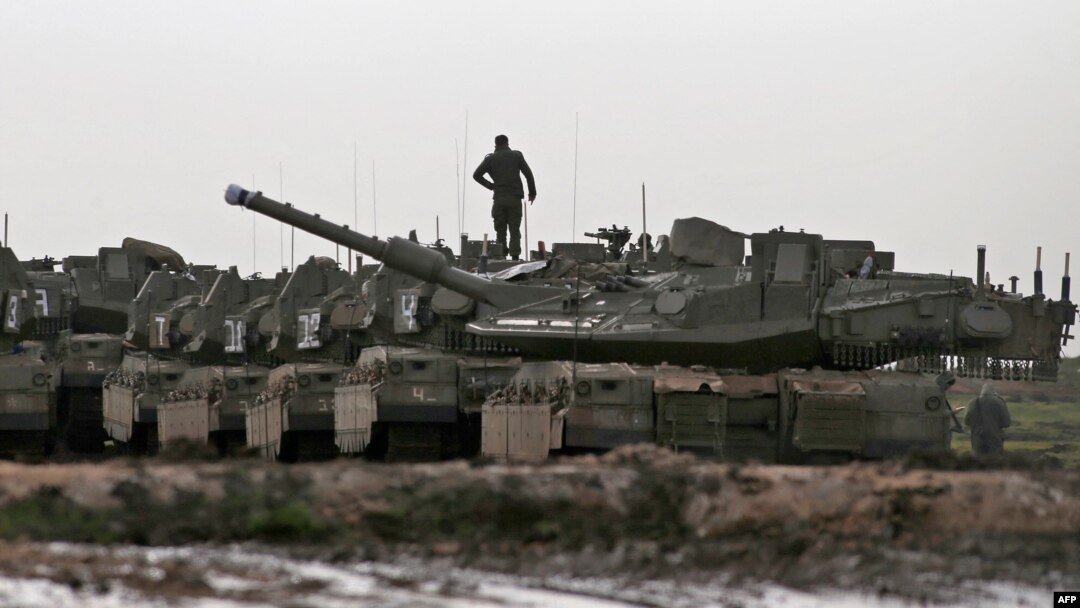 FILE - Israeli Merkava battle tanks are stationed during a military drill in the Israel-annexed Golan Heights, Jan. 31, 2022. 
