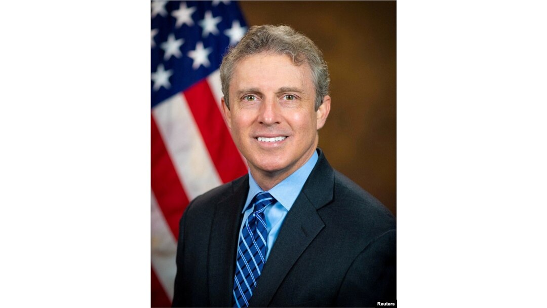 FILE - Special Counsel of the U.S. Office of Special Counsel Hampton Dellinger poses for a portrait in an undated handout image.
