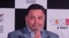 FILE - Bollywood actor Rishi Kapoor greets the media as he arrives for the song launch of the film '102 Not Out,' in Mumbai, India, April 19, 2018. He died Thursday at age 67.