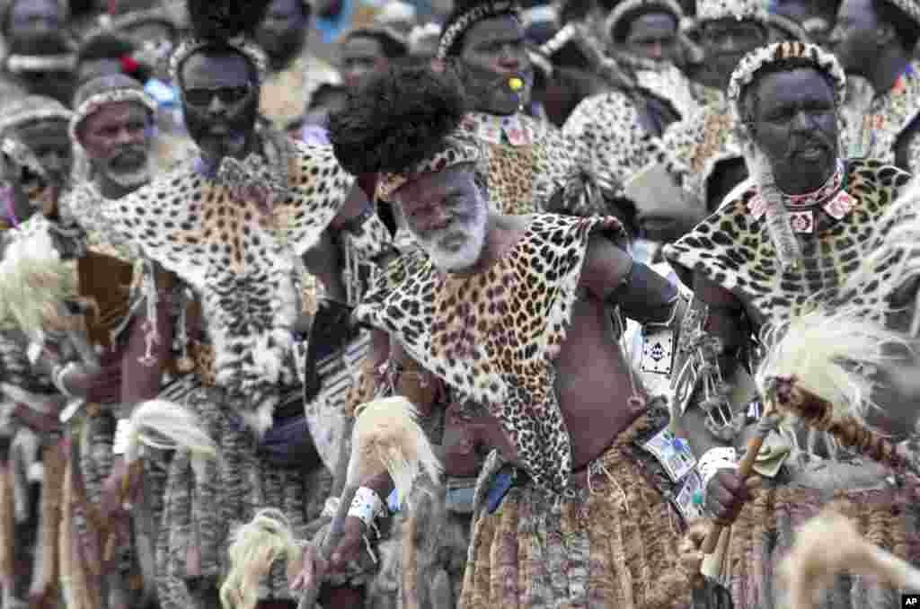 Members of the Shembe Church wearing leopard skins during their dance celebrations at eBuhleni, near Durban, South Africa. At least 1,200 men in ceremonial attire have danced at a mainly Zulu gathering wearing a mix of hides of illegally hunted leopards and Chinese-made, spotted capes designed by conservationists to reduce demand for the real thing. 