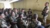 This picture released by the French Army shows French soldiers of the 21st Marine Infantry Regiment during a briefing before flying to Bamako, the capital from Mali, at the N'Djamena airport in Chad, Jan. 11, 2013.