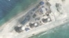 FILE - Construction is shown on Fiery Cross Reef, in the Spratly Islands, the disputed South China Sea in this March 9, 2017, satellite image released by CSIS Asia Maritime Transparency Initiative at the Center for Strategic and International Studies (CSIS).