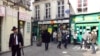 FILE - People walk in the street in the Marais Jewish quarter in Paris.