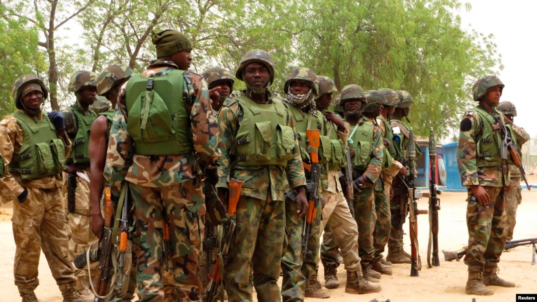 Nigerian soldiers are seen on the outskirts of Maiduguri in the north-eastern state of Borno in this May 13, 2013, file photo.