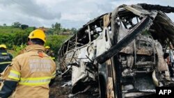 A photo released by the Minas Gerais Fire Department shows firefighters and other rescue teams working on the site of a crash in Teofilo Otoni, Minas Gerais state, Brazil, on Dec. 21, 2024.