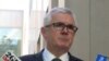 FILE - Australian lawmaker Andrew Wilkie addresses the media outside Parliament House in Canberra, Oct. 18, 2017. Wilkie accused a major Australian casino company of rigging slot machines and concealing potential money laundering.