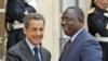 France's President Nicolas Sarkozy (L) greets Senegal's newly-elected President Macky Sall at the Elysee Palace in Paris, April 18, 2012.