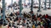 Migrant laborers, who arrived from Gujarat state on a train, are seen before proceeding for their native villages in their home state of Uttar Pradesh in Prayagraj, India, May 6, 2020.