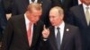 FILE - Russian President Vladimir Putin, right, and Turkish President Recep Tayyip Erdogan chat during a group photo session for the G-20 Summit at the Hangzhou International Expo Center in Hangzhou in eastern China's Zhejiang province, Sept. 4, 2016.
