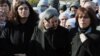 Several hundred Turkish Kurds, including lawmakers Sebahat Tuncel, left, and Gultan Kisanak, center, gather to protest the killings of three Kurdish women in Paris, France, in southeastern Turkish city of Diyarbakir, Turkey, January 10, 2013.