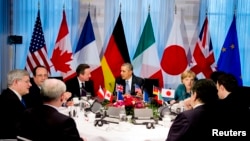 FILE - President Barack Obama (C) participates in a G7 leaders meeting during the Nuclear Security Summit in The Hague March 24, 2014.