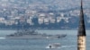 FILE - A Russian warship passes through the Bosphorus, in Istanbul, en route to the Mediterranean Sea, Oct. 6, 2015. 