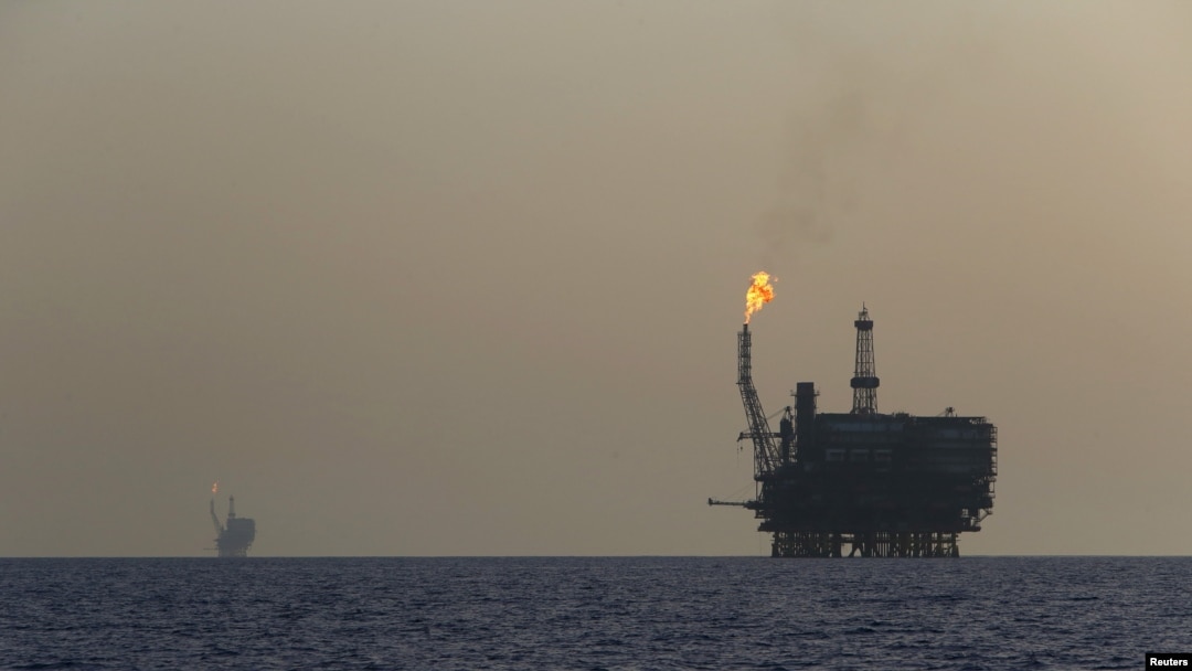 FILE - Offshore oil platforms