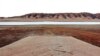 FILE - A boat ramp leads to the drought-affected Split Rock Dam near Tamworth in rural Australia, Sept. 23, 2019. 