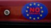A car sticker with a logo encouraging people to leave the EU is seen on a car, in Llandudno, Wales, February 27, 2016.