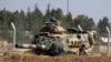FILE - A Turkish army tank is seen near the Syrian border in Suruc, Turkey, Sept. 3, 2016. Since then, tanks have entered Syria's Cobanbey district as part of the Euphrates Shield operation to aid Syrian rebels against the Islamic State group.