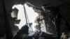 Free Syrian Army fighter watches over enemy position as rebel fighters belonging to Liwa Al Tawhid carry out military operation, Moaskar front line, Karmal Jabl neighborhood, Aleppo, Oct. 24, 2012.