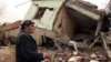 A resident walks on the rubble of a destroyed house in the mostly Kurdish town of Silopi, Turkey, Jan. 19, 2016. Turkey's president has ruled out any further peace efforts with Kurdish rebels.