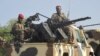 FILE - A convoy of Cameroonian soldiers reinforces its military front against Nigerian Islamist group Boko Haram.