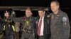 The Solar Impulse plane's project president and pilot, Bertrand Piccard (L) celebrates with co-founder and CEO Andre Borschberg (R) and Moroccan Agency for Solar Energy (MASEN) CEO Mustapha Bakkoury after the plane landed following a 19-hour flight from M